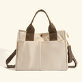 Bagviera canvas work tote bag, cream, lifestyle shot with model carrying the tote