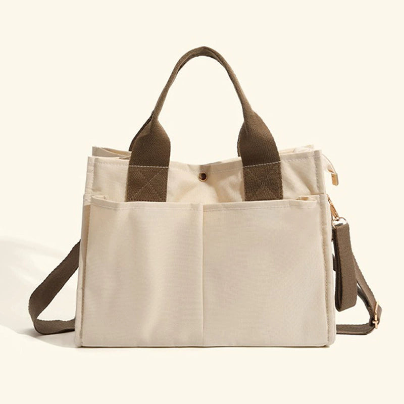 Bagviera canvas work tote bag, cream, lifestyle shot with model carrying the tote