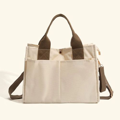 Bagviera canvas work tote bag, cream, lifestyle shot with model carrying the tote