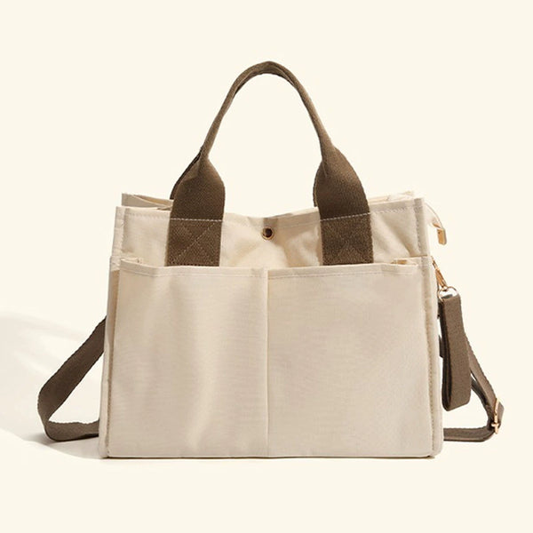 Bagviera canvas work tote bag, cream, lifestyle shot with model carrying the tote