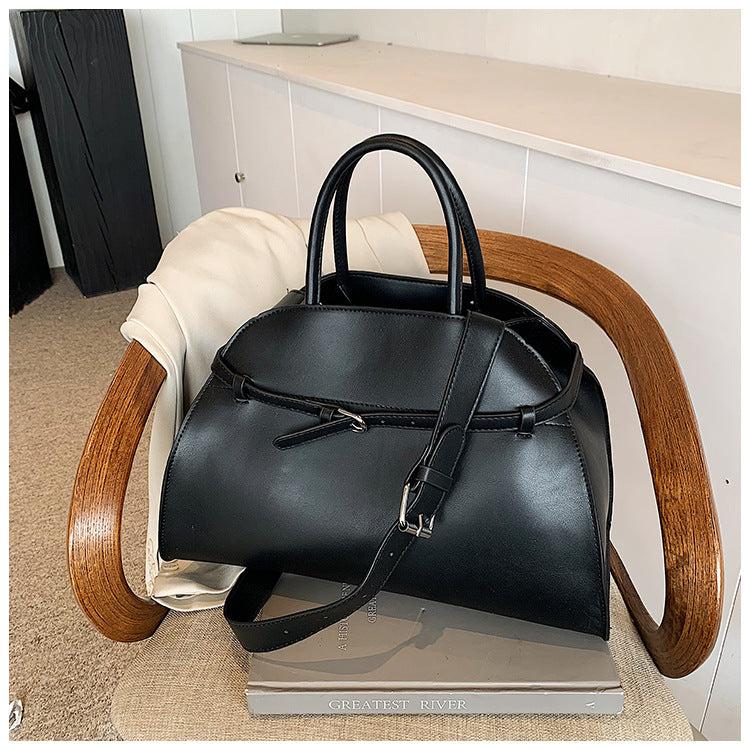 Hollis Relaxed Tote, black armchair